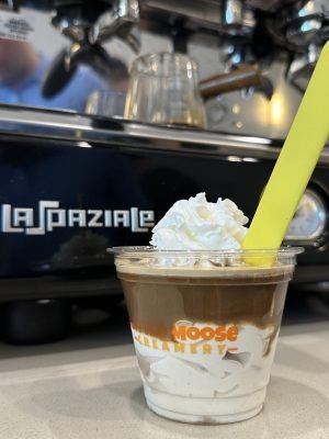 A delicious affogato topped with whipped cream and a spoon, served at Little Moose Creamery in Frisco, TX
